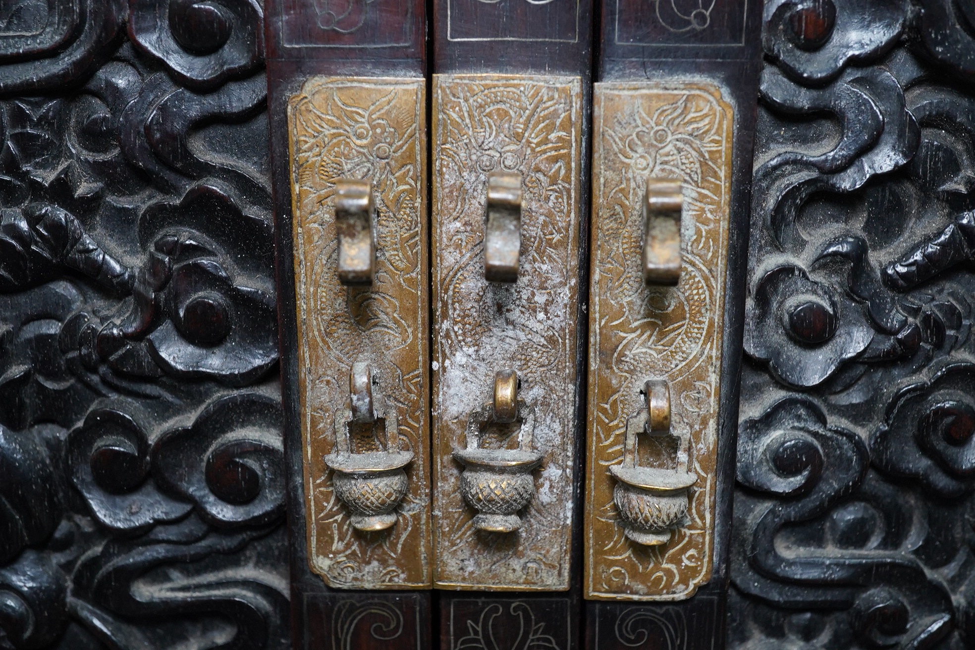 An important pair of Chinese carved zitan and silver wire inlaid ‘cloud and dragon’ curio cabinets and stands, duobaoge, probably Imperial, late Qing dynasty